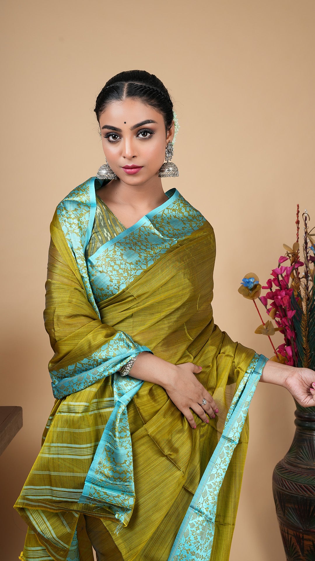 A dark olive silk saree