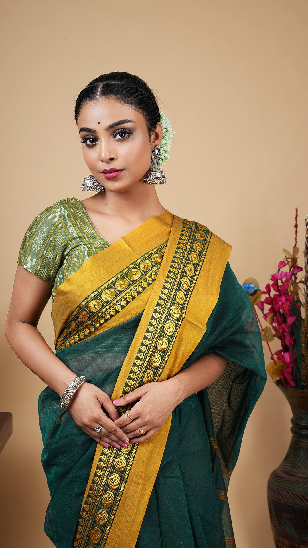 A deep green tangail saree