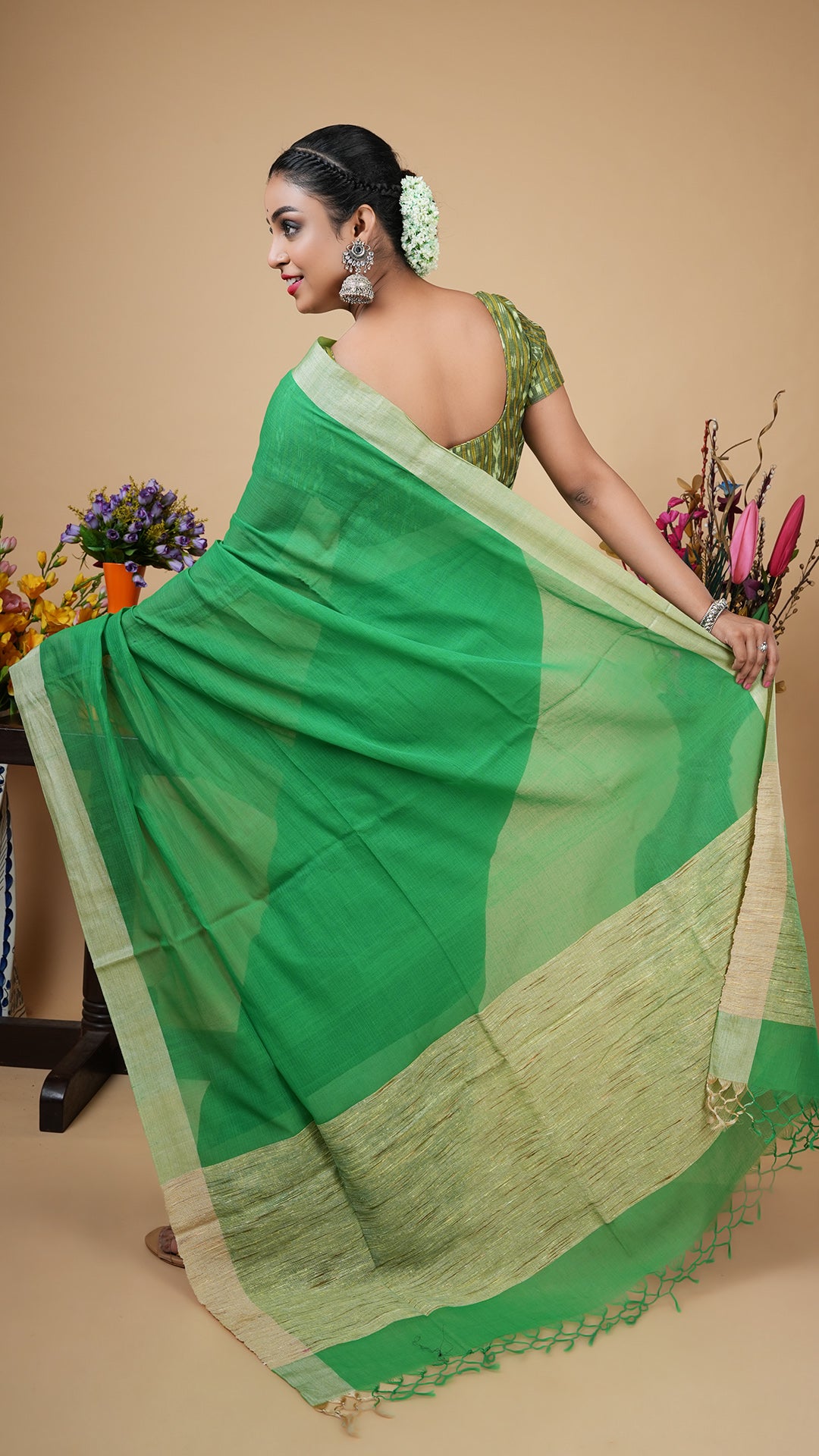A green tassar border saree
