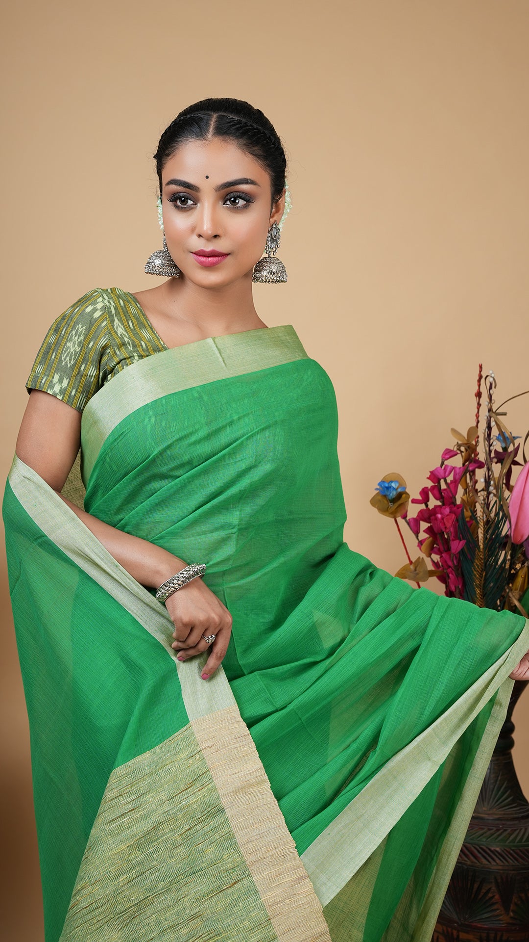 A green tassar border saree
