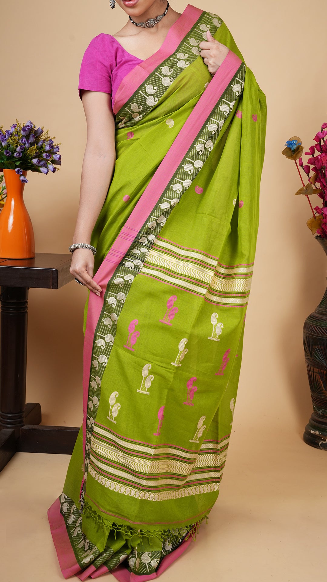 A green and pink tangail saree