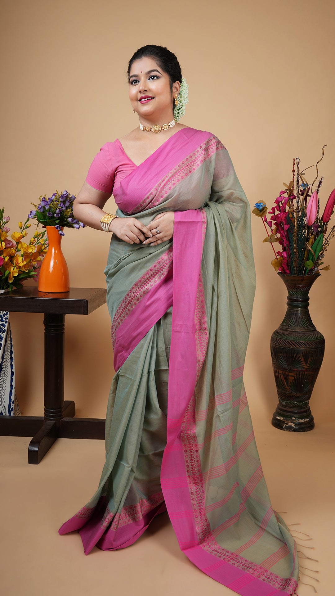 Pale pesta soft cotton tangail saree with pink woven border and vertical striped pallu. No butis. Simple daily traditional wear.