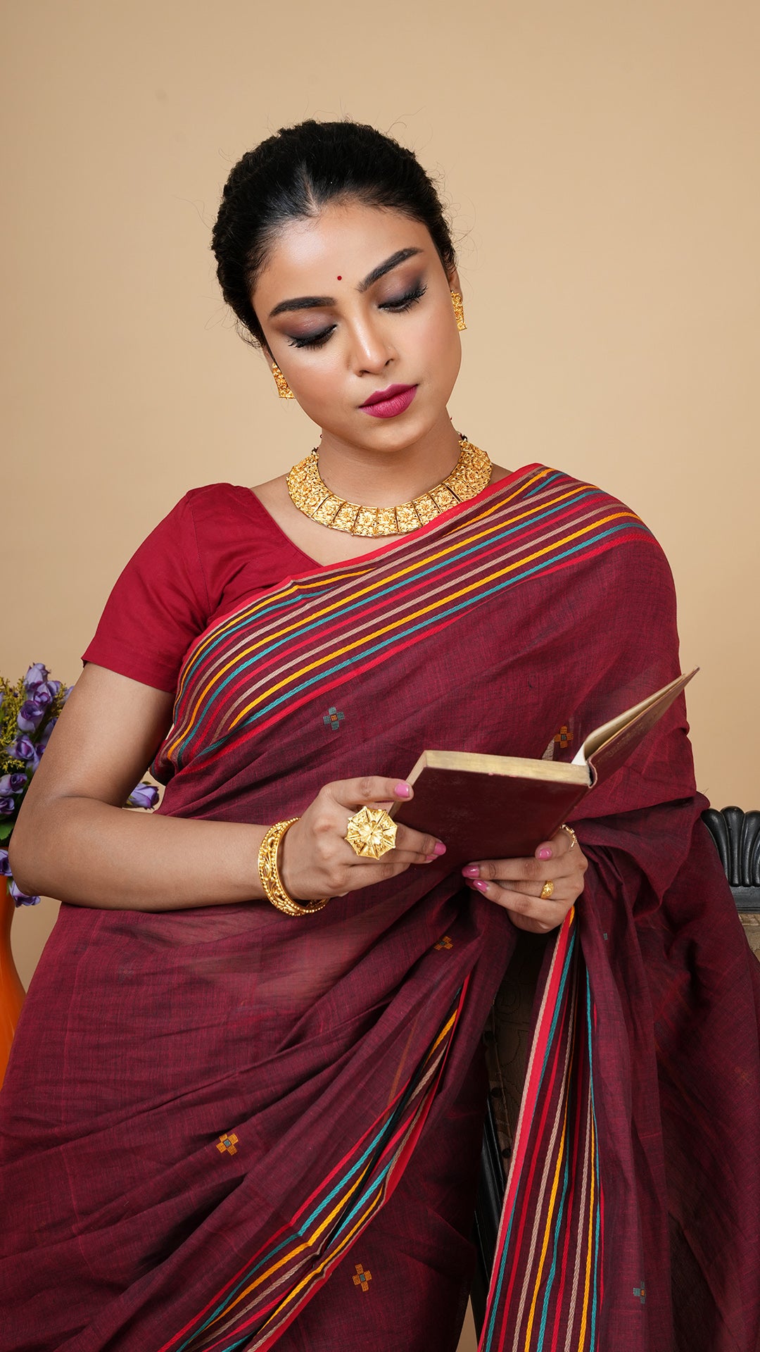 A soft tangail saree in short maroon colour