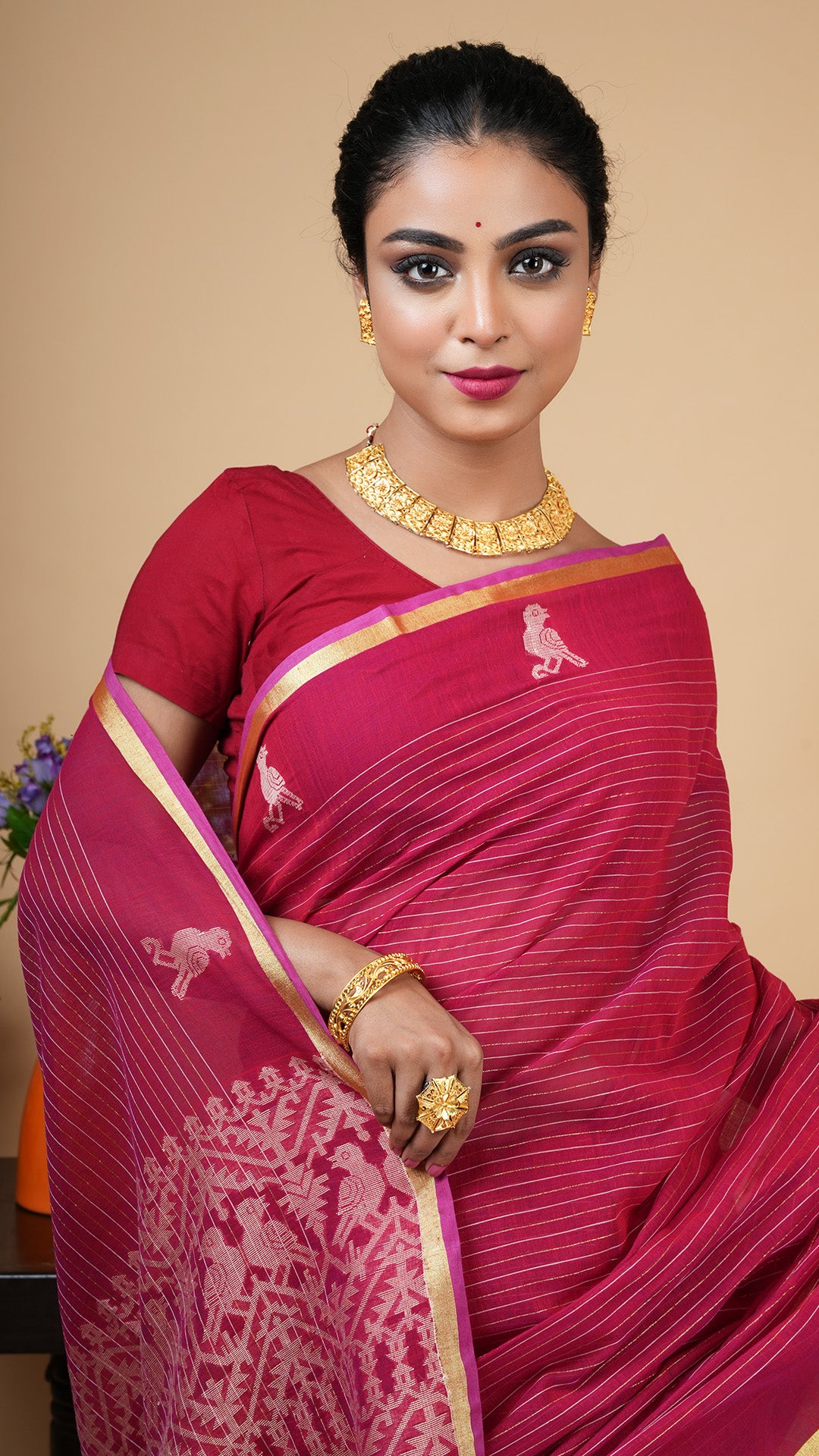 A tangail saree in maroon colour