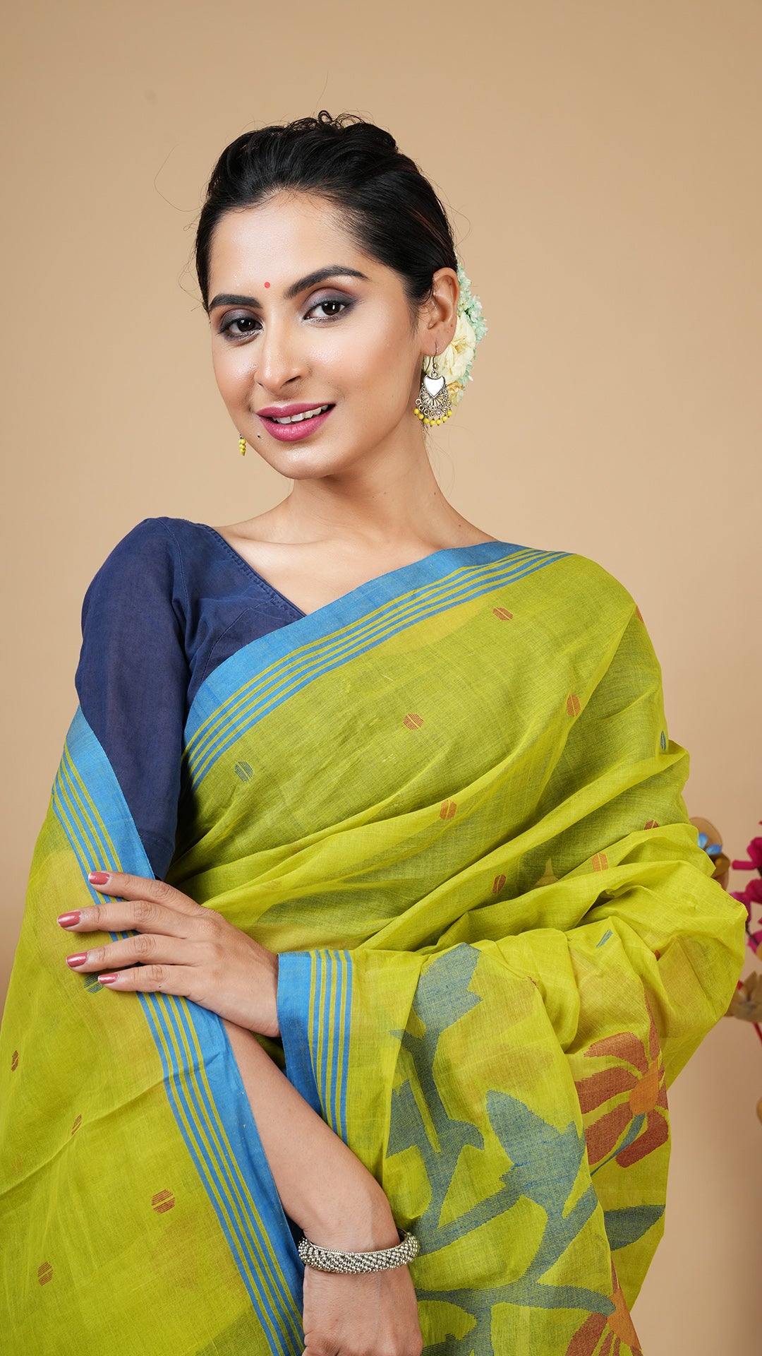 A green coloured dhakai saree