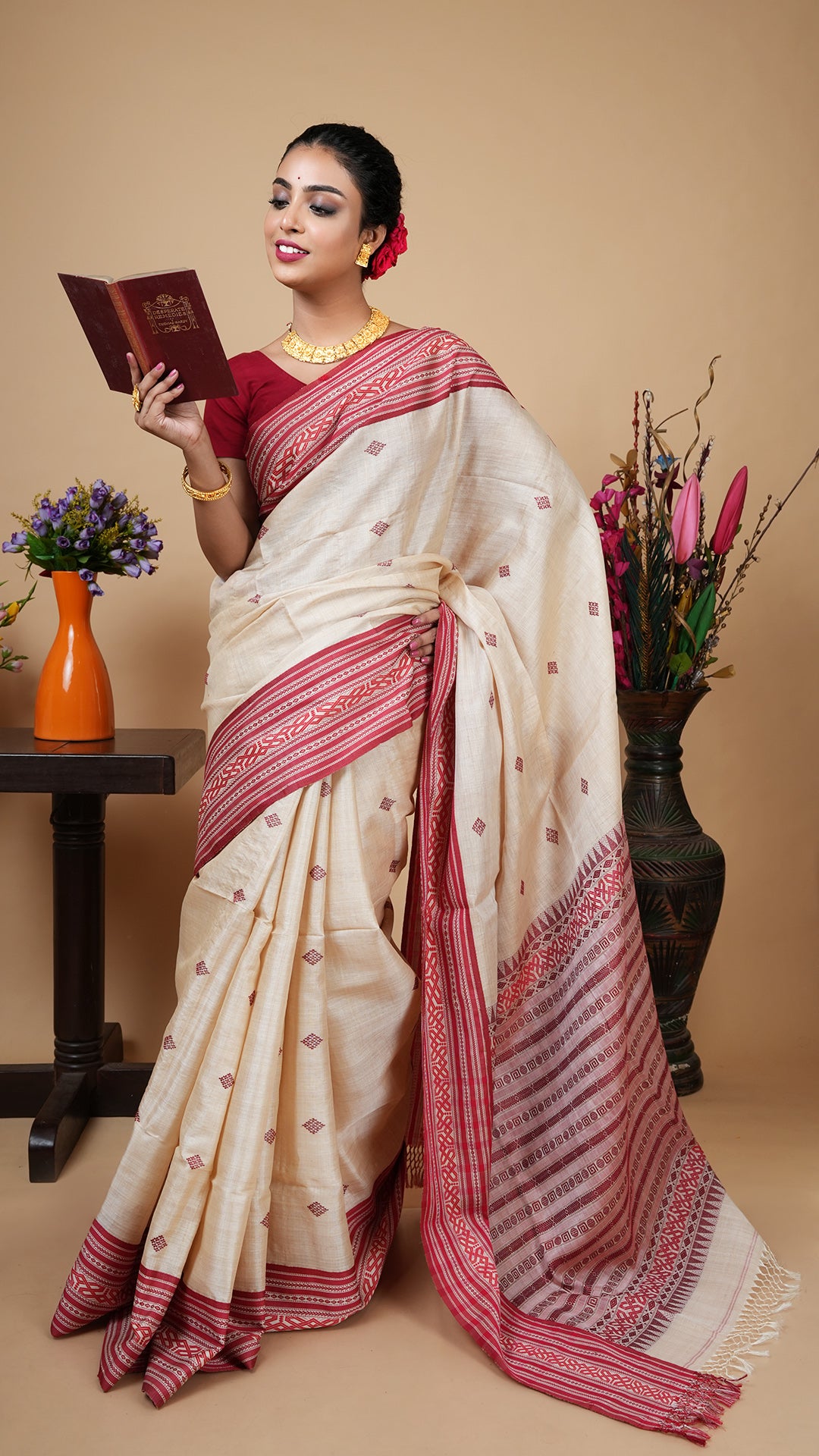 Elegant tassar saree in red and maroon Tangail weave, full drape front view with traditional motifs, lightweight handloom saree perfect for festive and ethnic wear
